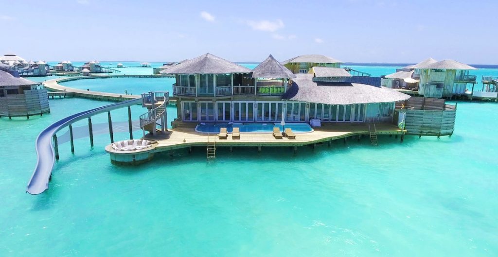 Overwater bungalow with slide and pool at The Maldives