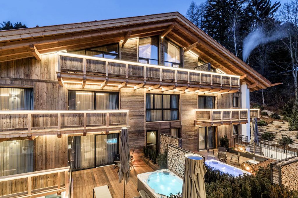 Wooden chalet luxury suites with whirlpool and garden furniture
