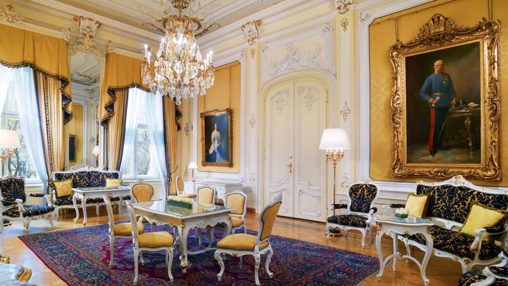 Imperial Hotel Royal suite salon view - palace like interior with crystal chandeliers
