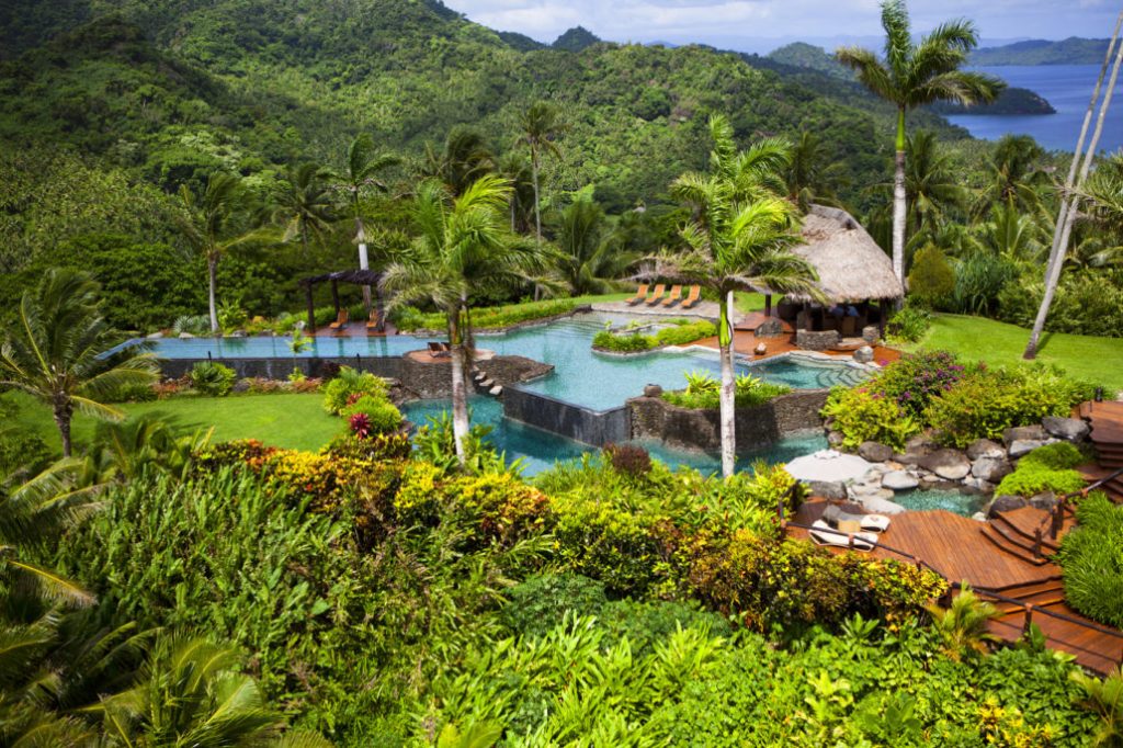 Infinity pool with waterfall green surroundings Fiji Private island 