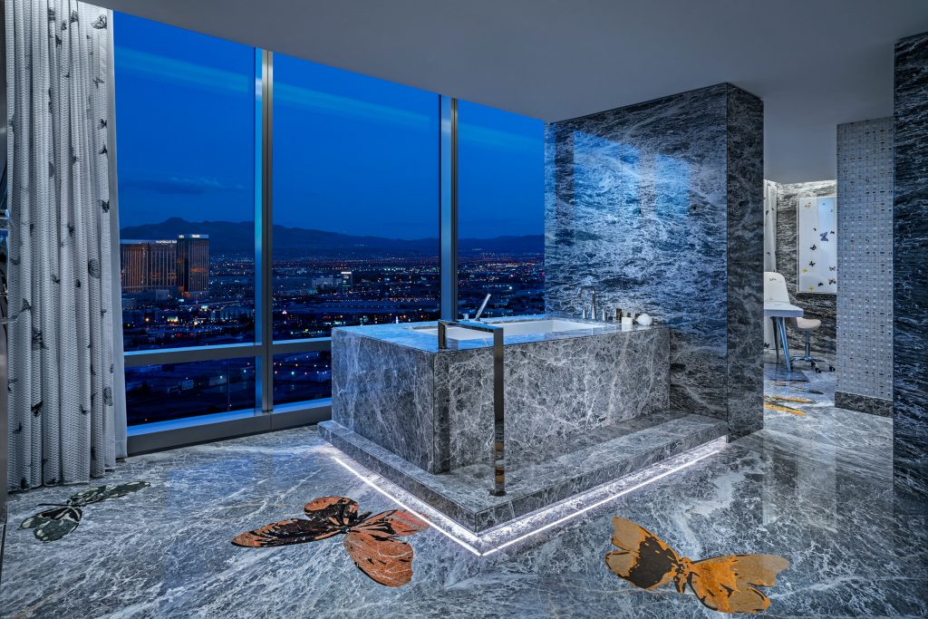 grey marble bathroom floor to ceiling windows panoramic bath tub