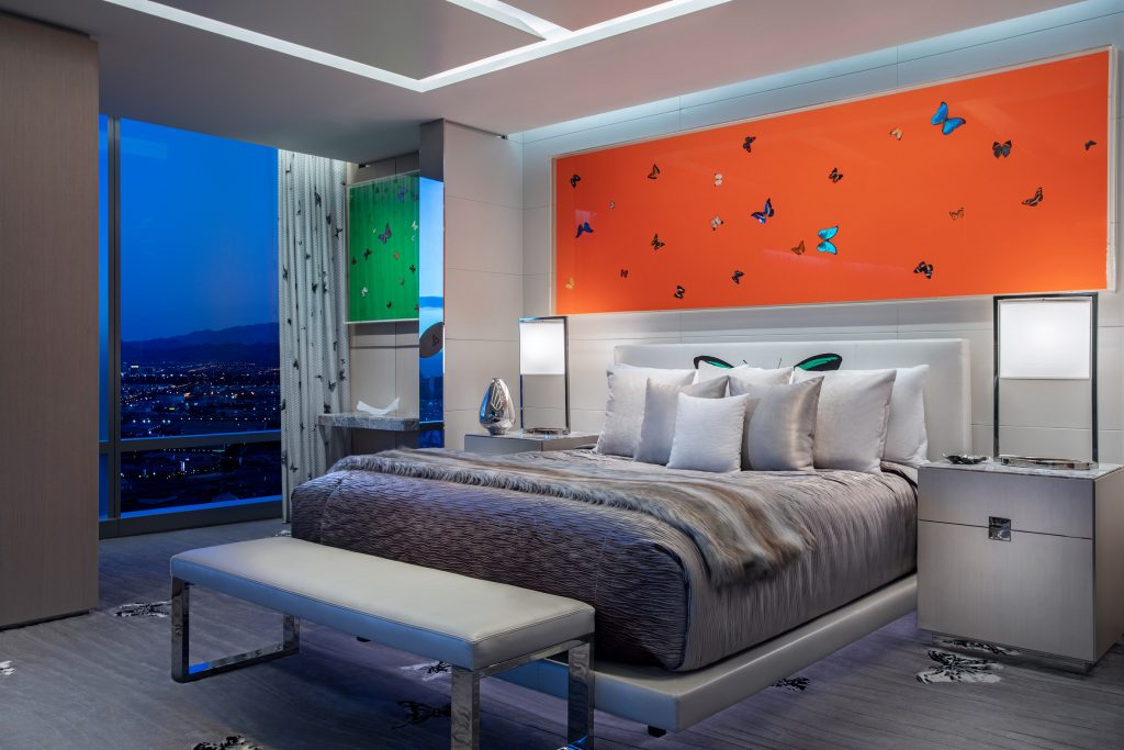 bedroom with butterflies and large windows grey interior with colored accessories 